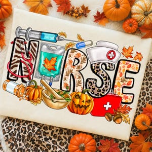 May include: A white fabric surface featuring the word NURSE in large, patterned letters. The design includes a syringe, IV bag, stethoscope, pill bottle, mortar and pestle, nurse cap, and first aid kit, all surrounded by autumn leaves and pumpkins.