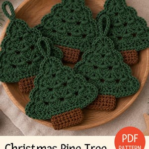 May include: Five crocheted ornaments shaped like Christmas pine trees, each featuring dark green foliage with a textured stitch pattern and a solid brown rectangular base, topped with a small matching green loop for hanging purposes.