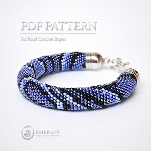 May include: A bead crochet rope bracelet featuring a repeating pattern of black, light blue, and dark blue glass beads. The bracelet includes silver-toned metal end caps and a lobster claw clasp. Text reads PDF PATTERN Set Bead Crochet Ropes.