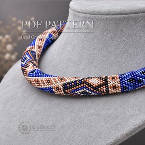 May include: A bead crochet rope necklace featuring a geometric pattern in shades of blue, metallic copper, and black. The text PDF PATTERN Bead Crochet Rope is visible at the top, and the Emerant logo is visible at the bottom left corner.