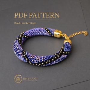 May include: A PDF pattern for a bead crochet rope bracelet featuring a spiral design of purple, blue, and black beads with gold-toned metal end caps and an adjustable chain link extension. The text reads PDF PATTERN Bead Crochet Rope EMERANT.