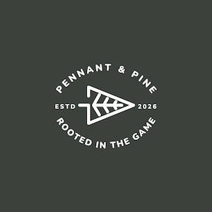 May include: A white logo on a dark green background. The logo features the text "PENNANT & PINE" in a circular arrangement, with "ESTD 2026" and "ROOTED IN THE GAME" also in a circular arrangement. A white arrow-shaped design is in the center.