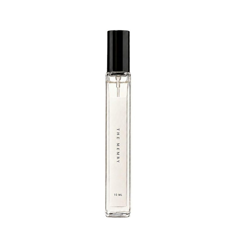 May include: A tall, slender, clear glass perfume bottle with a black cylindrical cap and a spray nozzle. The white label on the front features the text THE MEMRY and 10 ML in black font. The bottle contains a clear liquid and has a rectangular shape.