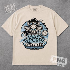 May include: Cream-colored t-shirt featuring a cartoon monkey wearing sunglasses and a bow tie, holding baseball bats. The shirt has the text "Party Animals Baseball" with Japanese text below. The Retro Prints Club logo is in the upper left corner.