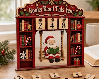 May include: A red wooden Books Read This Year tracker featuring a Santa Claus figure on a swing reading a book. The structure includes shelves with miniature books, candy canes, and a gift. Three wooden number tiles display 248, with extra tiles.