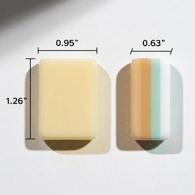 May include: Two rectangular tiles with smooth, glossy surfaces. The larger tile is solid cream and measures 0.95 inches by 1.26 inches. The smaller tile features vertical stripes of tan, light green, and white, measuring 0.63 inches in width.