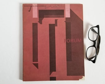 May include: A red magazine cover with the title "FORUM" and the text "THE ARCHITECTURAL FORUM / OCTOBER 1963" printed on the top. The cover features a geometric design in brown and red.