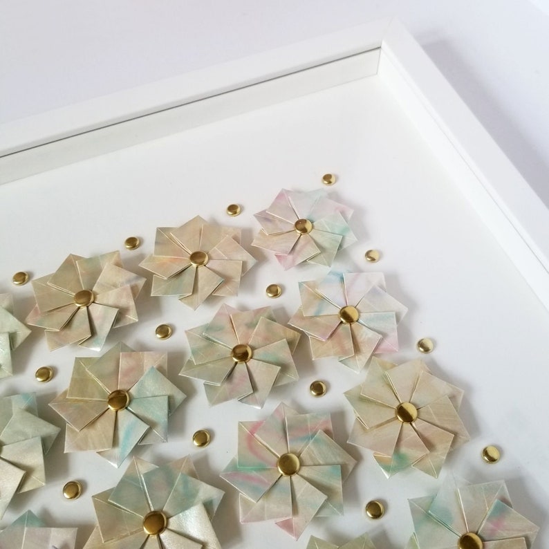 A close up of the top right portion of the artwork showing the corner of the shadow box frame.