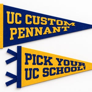 May include: Two triangular felt pennants. The top pennant is blue with yellow text reading UC CUSTOM PENNANT and yellow side ties. The bottom pennant is yellow with blue text reading PICK YOUR UC SCHOOL! and blue side ties on the left edge.
