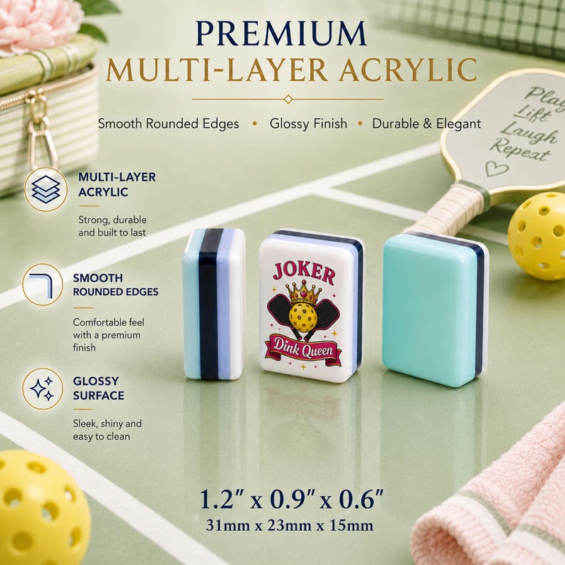 May include: Three multi-layer acrylic pickleball accessories. One is light blue, one is striped with blue and white, and the other is white with a "Joker Dink Queen" graphic. The text "Premium Multi-Layer Acrylic" is at the top.