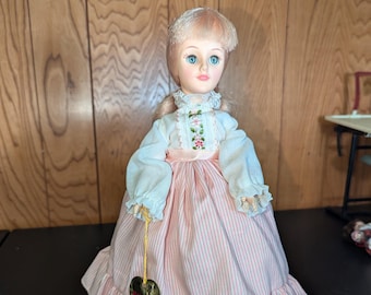 Effanbee 1981 Vinyl Doll, Blonde Hair, Green eyes - poseable head, eyes close and open - pink stripe dress, white puff sleeves