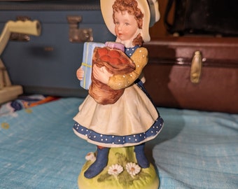 1973 Holly Hobbie Ceramic Figurine 8" Bonnet & arms full of gifts, curly red hair, blue dress | World Wide Art INC | made in Japan Vintage