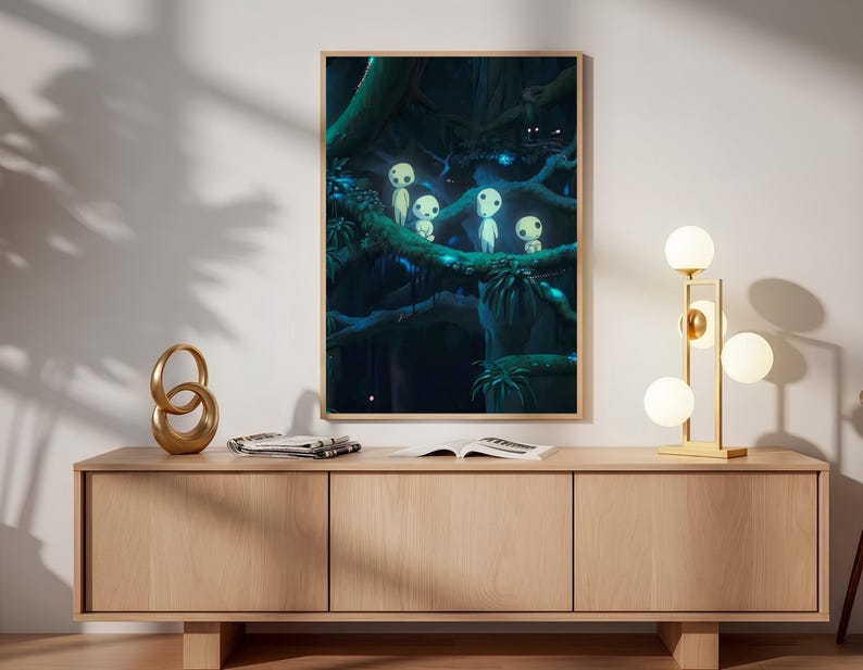 May include: A rectangular framed wall art print featuring a dark forest scene with four small, glowing white spirits perched on thick tree branches. The artwork uses deep shades of blue and green to depict a dense, mysterious woodland environment.
