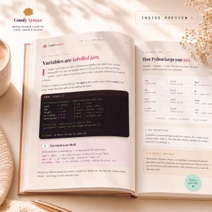 May include: An open educational book titled Comfy Syntax, Chapter 1 Variables, featuring a page explaining Python variables using a jar analogy. The text includes code snippets, a memory diagram table, and a section titled The Bathroom Shelf.