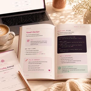 May include: An open book titled The Coding Journal with a page displaying a Mood Checker project. The page features text, a dark code block with Python syntax, and sections labelled Goal, What You'll Learn, and Try It Yourself with pink accents.