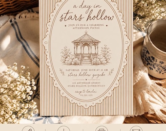 May include: A rectangular invitation card with a cream background and brown vertical stripes. It features a central oval frame containing a detailed illustration of a gazebo, with text reading a day in stars hollow, join us for a charming afternoon picnic, Saturday, June 20th at 11 am, stars hollow gazebo, 123 anywhere street, stars hollow, Connecticut, and rsvp to lorelai 111.111.1111.