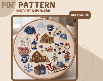 May include: A cross-stitch pattern in a wooden embroidery hoop featuring winter-themed icons including two cabins, a sled, ice skates, a blue sweater, mittens, a mug, a candle, a wreath, a pine tree, snowflakes, and a pitcher with red berries.