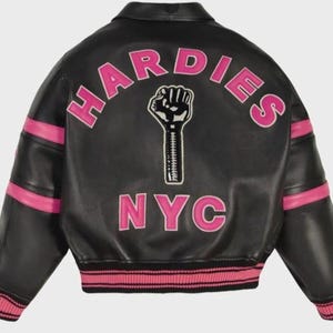 May include: A black leather bomber jacket featuring pink stripes on the sleeves and pink ribbed cuffs and hem. The back displays the text HARDIES in a pink arch, the text NYC in pink below, and a central graphic of a black fist with a zipper.
