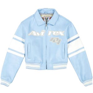 May include: A light blue leather jacket featuring a white stripe on each sleeve, a front zipper closure, and a ribbed hem and cuffs. The chest displays the text "Avirex" and the number "04" in white and silver lettering with a classic collar.