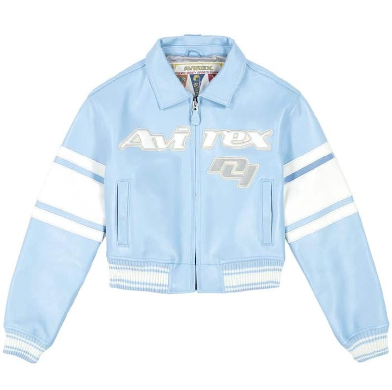 May include: A light blue leather jacket featuring a white stripe on each sleeve, a front zipper closure, and a ribbed hem and cuffs. The chest displays the text "Avirex" and the number "04" in white and silver lettering with a classic collar.