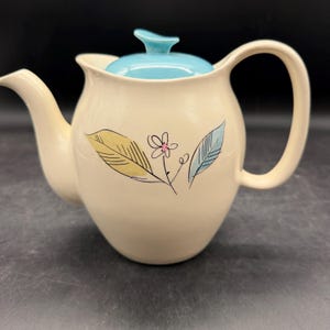 May include: A rustic wooden sign with the text "Welcome to our home" in white lettering. The sign features a distressed finish and a simple, inviting design, perfect for entryway decor.