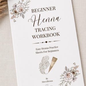 May include: A white workbook titled Beginner Henna Tracing Workbook with floral illustrations in the corners. The cover features a graphic of a henna cone and a swirl design, with the text Easy Henna Practice Sheets For Beginners by How2Henna.