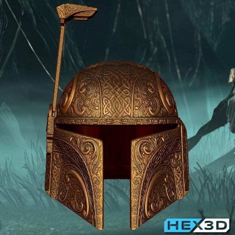 May include: A gold-coloured helmet with detailed patterns and designs. The helmet has a visor and a long antenna-like structure. The text "HEX3D" is visible. The design is reminiscent of historical armour.