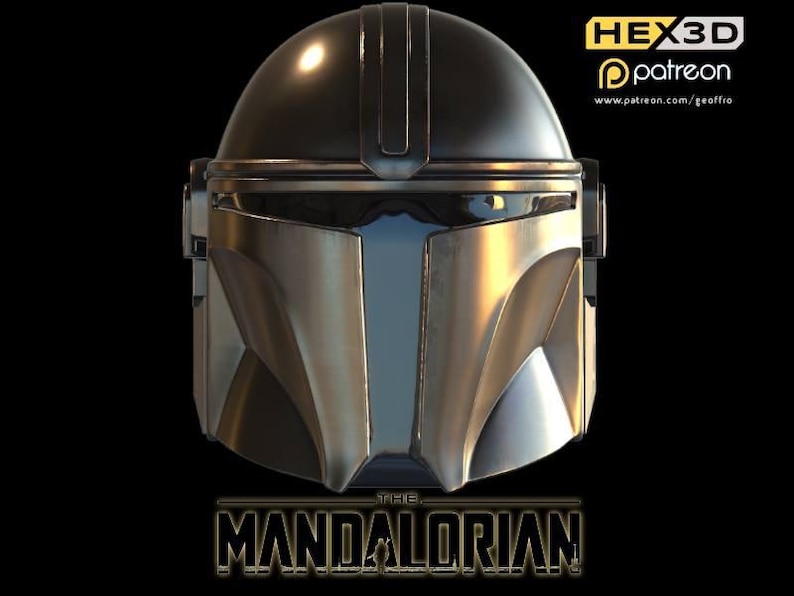 May include: A silver and black Mandalorian helmet with a dark visor. The helmet has a rounded top and angular features. The words "THE MANDALORIAN" are displayed in a gold, stylized font at the bottom of the image.