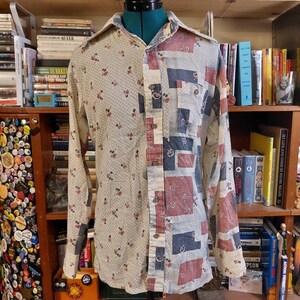 May include: A long-sleeve button-down shirt featuring a split design. The left side has a cream background with a small red and green floral pattern, while the right side displays a patchwork of blue, red, and cream geometric and floral squares.