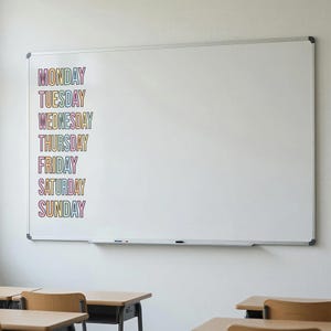 May include: A large rectangular white dry-erase board featuring a vertical list of the days of the week from Monday to Sunday. Each word is written in a bold, sans-serif font with a colorful, multi-hued gradient fill and a thin black outline.