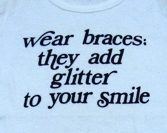 WEAR BRACES, they add glitter to your smile vintage t-shirt seventies 70s retro font PMA positivity smile