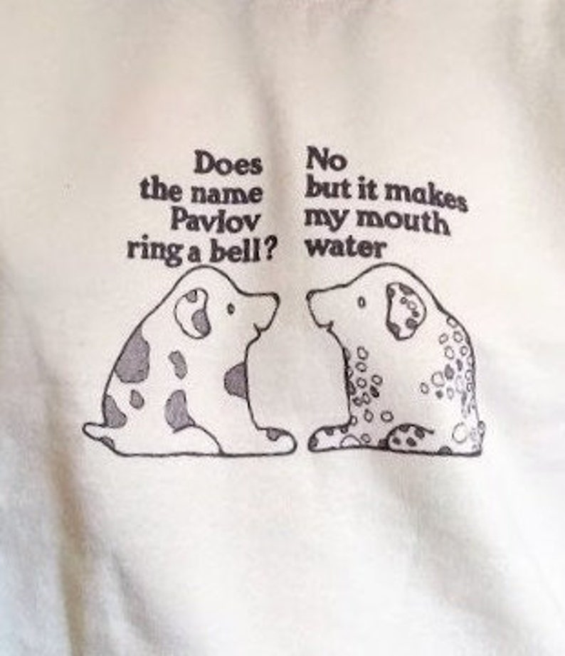 May include: Two cartoon dogs with black spots are facing each other. The dog on the left says "Does the name Pavlov ring a bell?" The dog on the right says "No but it makes my mouth water."