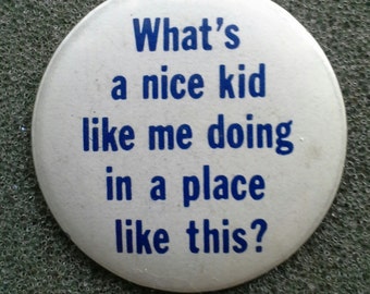 Retro '80s Button -"What's a nice kid like me doing in a place like this?" Never-Worn, Like-New Condition.