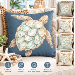 May include: A square throw pillow featuring a sea turtle illustration where the shell is composed of multiple oyster shells in shades of blue, green, and tan. The turtle has driftwood-colored flippers and head, set against a solid dark blue background.