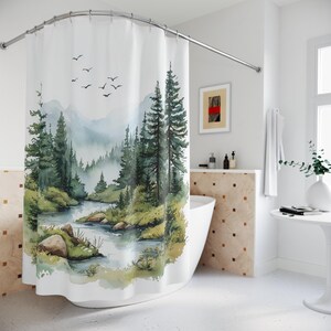 May include: A white shower curtain featuring a watercolor-style landscape print of a winding river flowing through a dense forest of tall pine trees, with soft blue mountains in the background and a flock of birds flying in the sky above.