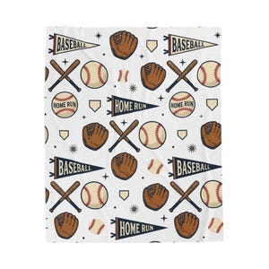 May include: White baseball-themed blanket with a repeating pattern of baseballs, mitts, crossed bats, and pennants. The pennants read "BASEBALL" and "HOME RUN". The baseballs are red and white, and the mitts are brown.