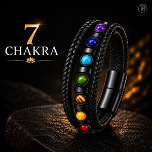 May include: A black braided leather bracelet featuring seven round, multi-colored stones in purple, blue, turquoise, green, orange, yellow, and red. The bracelet includes a black metal magnetic clasp and displays the text 7 CHAKRA.
