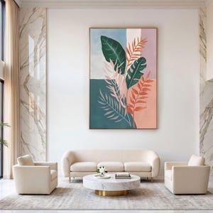 May include: A large rectangular wall art piece featuring a botanical illustration of various tropical leaves in shades of dark green, light pink, and peach, set against a color-blocked background of soft blue, white, and muted pink, framed in thin gold.