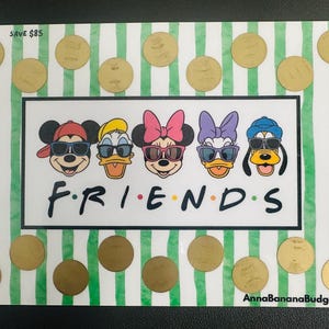 May include: A rectangular savings challenge tracker featuring a white and green striped background with gold scratch-off circles. The centre displays cartoon characters wearing sunglasses above the text FRIENDS. Text includes SAVE $85 and AnnaBananaBudgets.