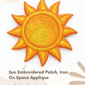 May include: A circular sun embroidered patch featuring a bright yellow center and orange rays. The patch measures 1-7/8 inches by 1-7/8 inches. The design is intended for iron-on application and is labeled as a Sun Embroidered Patch, Iron On Space Applique.