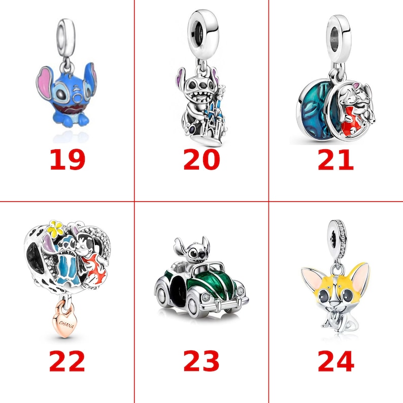 May include: A collection of six silver-toned metal charms labeled 19 through 24. The charms feature various characters and objects, including a blue alien, a castle, a moon, a car, and a yellow dog, with colorful enamel accents and text.