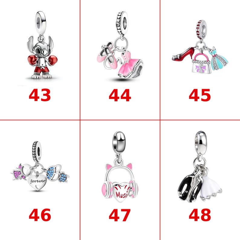 May include: A collection of six silver charms labeled 43 through 48. Charm 43 is a boxing character. 44 features ballet slippers and a dress. 45 shows a shoe, handbag, and dress. 46 has a heart with the word forever. 47 is headphones. 48 shows formal attire.