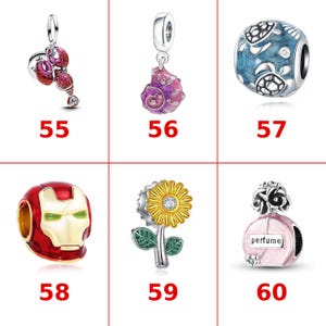 May include: A collection of six silver-toned charms labeled 55 through 60, featuring a red lobster, a purple seashell, a blue turtle bead, a red and gold mask, a yellow sunflower, and a pink perfume bottle with the text perfume printed on it.
