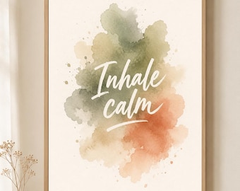 May include: A framed wall art print featuring a watercolor-style abstract design in muted green and terracotta tones. The text Inhale calm is written in white script across the center of the paint splatters, set within a light wood frame.