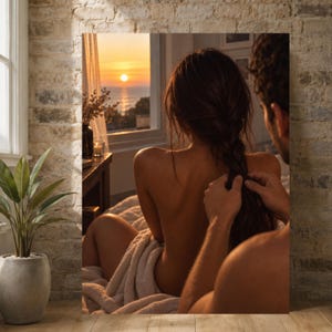 May include: A rectangular wall art print depicting a sunset over the ocean viewed through a window. The scene shows a person with long dark hair sitting on a bed, while another person braids their hair. The room features a brick wall and a potted plant.