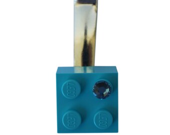 Turquoise Blue LEGO® brick 2x2 with a Blue SWAROVSKI® crystal on a Silver/Gold hair clip (one piece)