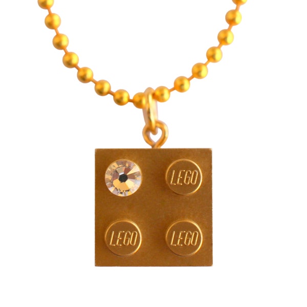 Metallic Gold LEGO® brick 2x2 with a ‘Diamond’ color SWAROVSKI® crystal on a 24" Gold plated ballchain