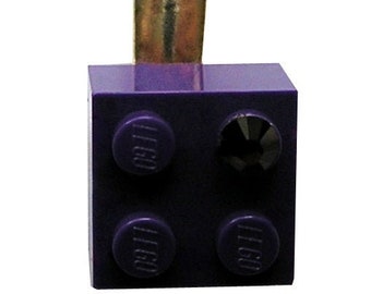 Purple LEGO® brick 2x2 with a Purple SWAROVSKI® crystal on a Silver/Gold hair clip (one piece)