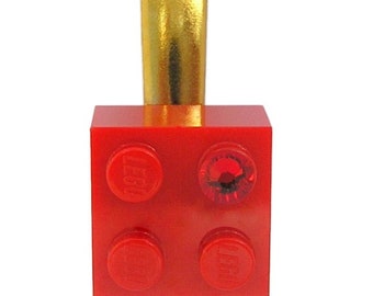 Red LEGO® brick 2x2 with a Red SWAROVSKI® crystal on a Silver/Gold hair clip (one piece)