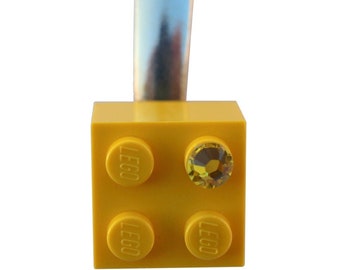 Yellow LEGO® brick 2x2 with a Yellow SWAROVSKI® crystal on a Silver/Gold hair clip (one piece)